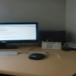 A remote workstation setup used for AI training work and evaluation tasks on computer monitors.