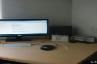 A remote workstation setup used for AI training work and evaluation tasks on computer monitors.