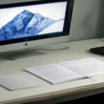 Graphic designer layout showing print book cover templates and sizing guidelines on a digital workspace.