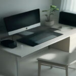 Smartphone and laptop on a clean desk displaying background network monitoring interfaces for passive earning apps.