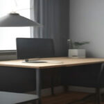 Smartphone configured on a desk stand for video screener submission and remote user research testing.