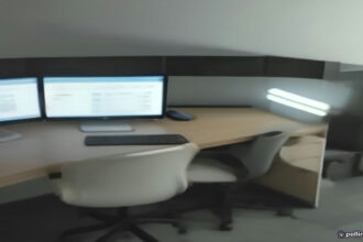 Dual monitor workplace setup displaying modern freelance workflow tools and digital project management software.