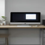 A seller desk with a laptop and digital drawing tablet used for designing print on demand merchandise.