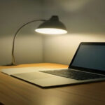Modern remote work setup with laptop open for online tutor interview preparation.