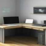 Minimalist home office workstation setup showing network performance monitoring on a laptop screen.