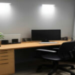 A clean home office desktop set up with headphones and monitors ready for remote call center contract work.