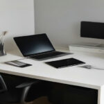 A modern writer workspace with a digital manuscript tablet and keyboard.