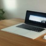 Minimalist remote work setup with laptop displaying dataset evaluation guidelines.