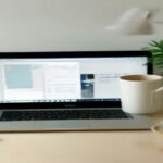 A remote developer workspace with code open on a screen, illustrating contract software engineering and AI work.
