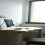 Laptop displaying an online research survey on a wooden office desk in soft natural daylight.