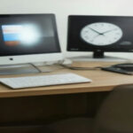 A modern home workspace with a laptop open to evaluation guidelines, representing remote search engine evaluator work.