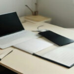 A modern home office desk set up for remote AI evaluation and data annotation work.